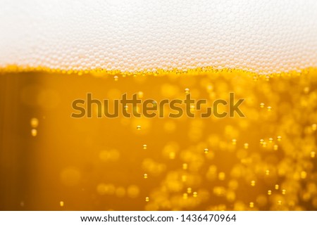 Beer background with whitecap (close)