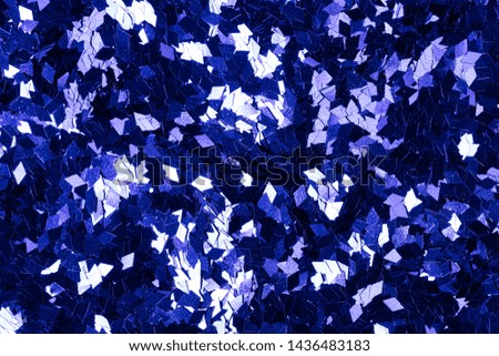 Superior holographic glitter background in stylish dark blue tone. High resolution photo.
