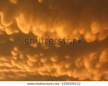 storm sky with orange and round clouds