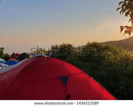 View the tent above the hill in the morning