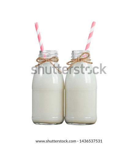 two bottles of milk with straw isolated on white background, clipping path