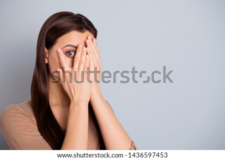 Close up photo beautiful she her lady ideal perfect appearance hands arms hide scared facial expression very scary movie look through palms wear casual pastel pullover sweater isolated grey background