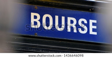  Bourse written on a white and blue panel in Paris. La France. English translation : stock exchange.