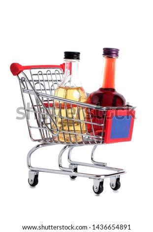 Metal cart whit bottle from store on a white background