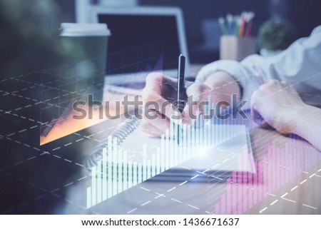 Forex chart displayed on woman's hand taking notes background. Concept of research. Double exposure