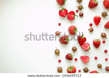 Red strawberry berries on a white background, top view