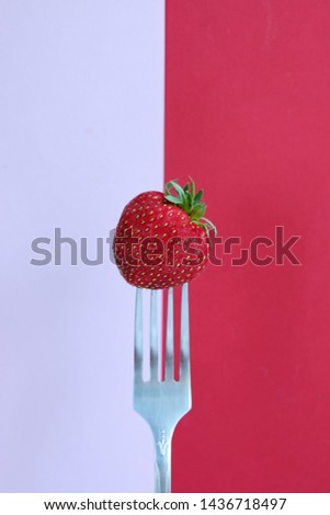 One strawberry on a fork, pop art