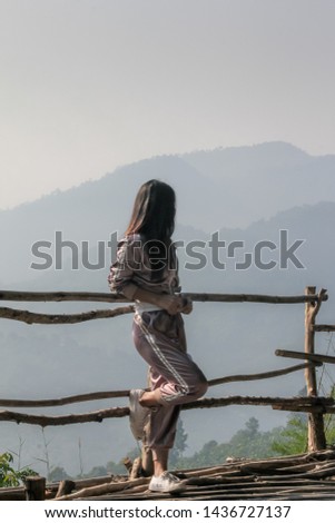 View from behind Beautiful Nature Landscape of thailand traveler woman in look  landscape of Mekong River from the top the Phu Huay Isan Sangkhom Nong Khai, Thailand,Landscape hdr style.