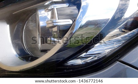 front car headlight closeup in the daytime