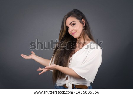 Young beautiful caucasian businesswoman over isolated background Inviting to enter smiling natural with open hands. Welcome sign.