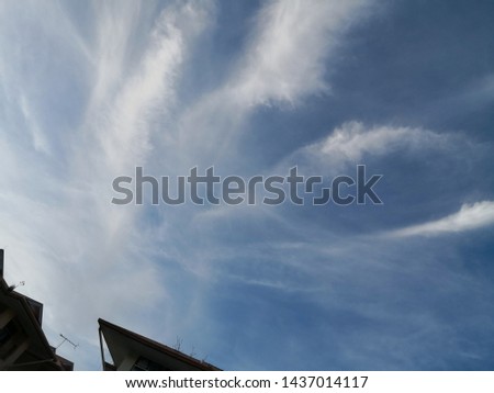 Beautiful white clouds formation on blue sky.