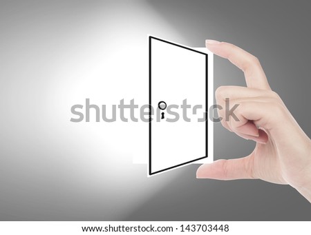 Hand holding an opened door