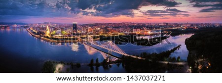 view of the downtown Krasnoyarsk, the bridge through the Yenisei River a sunset, shooting from air Royalty-Free Stock Photo #1437037271