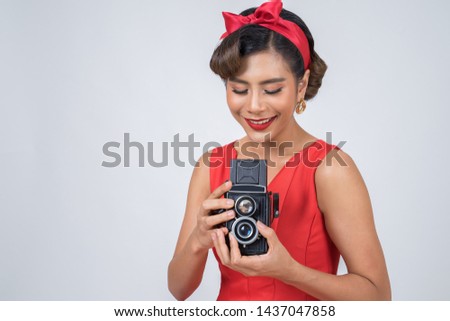 Happy fashion woman photographer hands holding retro vintage camera