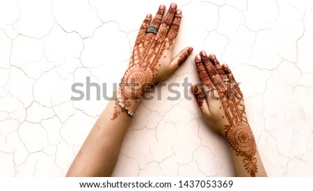 Bridal mehndi- henna tattoo on women hands. mehndi is a traditional indian decorative art. ( mehndi hands) Royalty-Free Stock Photo #1437053369