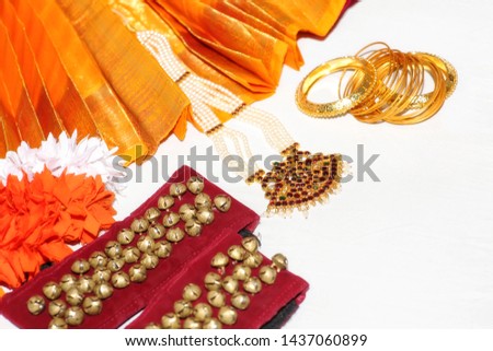 Indian classical dance Bharatanatyam costume and ornaments on display on white background shot with selective focus