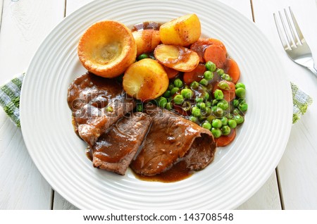 Roast Beef and Yorkshire Pudding Royalty-Free Stock Photo #143708548