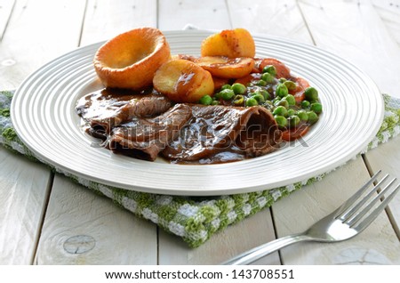 Roast Beef and Yorkshire Pudding Royalty-Free Stock Photo #143708551