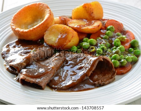 Roast Beef and Yorkshire Pudding Royalty-Free Stock Photo #143708557