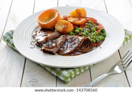 Roast Beef and Yorkshire Pudding Royalty-Free Stock Photo #143708560