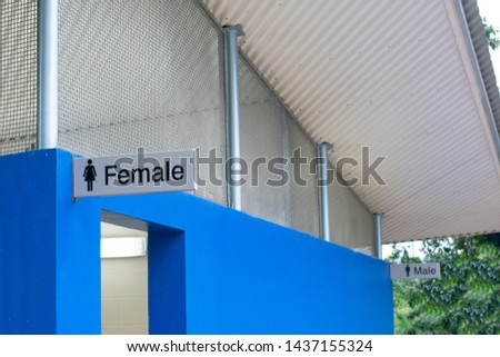 Female bathroom in front of male bathroom