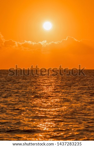 Colorful dawn over the sea, Sunset. Beautiful magic sunset over the sea. Beautiful sunset over the ocean. Sunset over water surface. vertical photo. toned