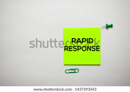 Rapid Response text on sticky notes with office desk concept
