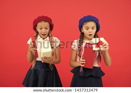 Big surprise. Cute girls opening their presents. Happy birthday surprise. Happy little children holding gift boxes. Preparing presents for mothers or fathers day. 8 march and womens day. Boxing day.