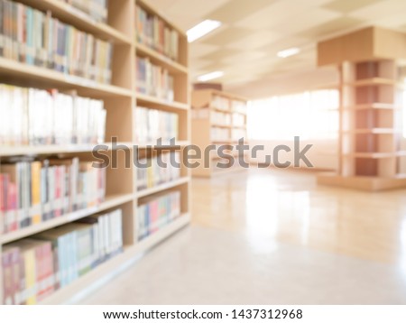 books on bookshelf in public library,  abstract blur defocused background Royalty-Free Stock Photo #1437312968