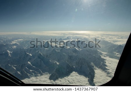 Himalaya mountains from the cockpit of a modern airliner