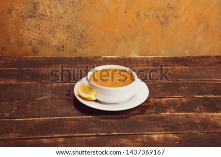 Delicious soup on wood rustic background