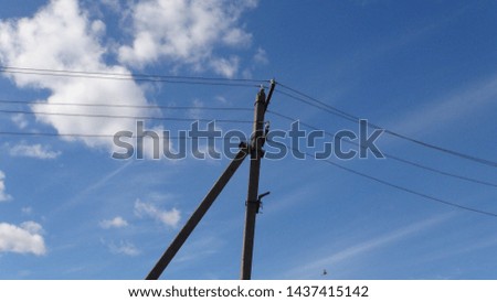 electronic pole with wires against the sky
