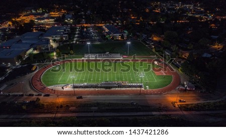 Aerial Drone Picture of an American High School Football Game played at night in Glenwood Springs, Colorado.