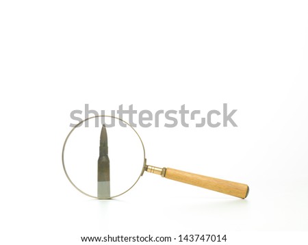 side view of a bullet seen through a magnifying glass, with a white background