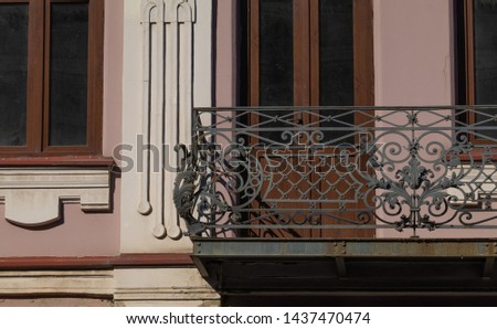 Elements of architectural decorations of buildings, balconies and windows, gypsum stucco. On the streets in Georgia, public places.