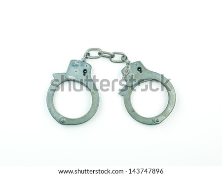 closed silver handcuffs, isolated on white backround