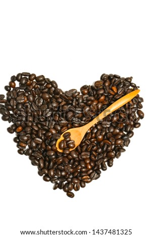Coffee beans and wooden spoons separately on the white background area to copy the area​ -  image