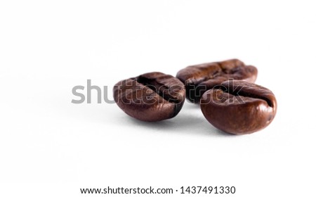 three coffee beans isolated. Closeup coffee beans on white background