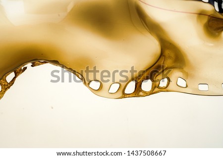 Detail shot of burned 35mm film or film material on bright background Royalty-Free Stock Photo #1437508667