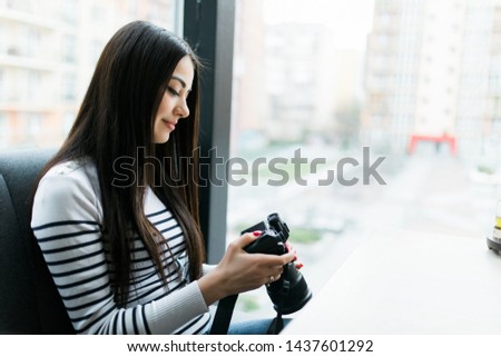 Freelance photographer woman with camera