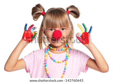 Portrait of happy little girl with red clown nose isolated on white background