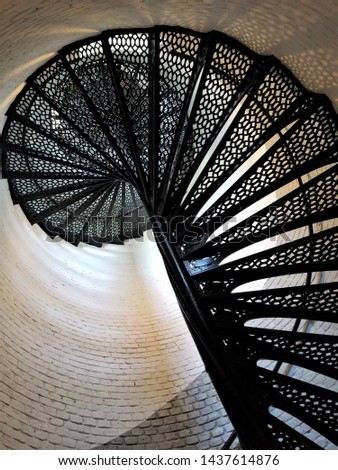 Looking Up Towards the Top of a Wrought Iron Spiral Staircase Inside a Lighthouse