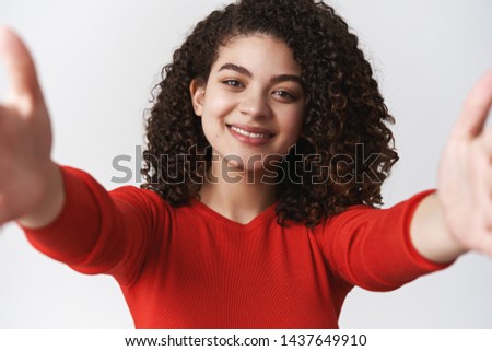 Close-up tender caring lovely young dark-haired girl curly hairstyle stretch hands camera taking selfie making self photograph grinning cute silly post personal blog online, white background