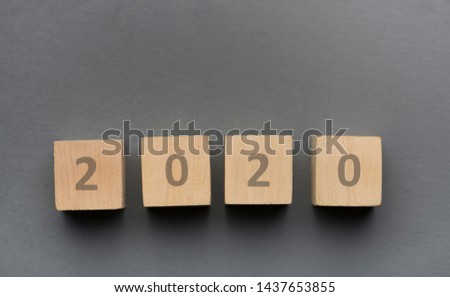 2020 concept. Wooden blocks with text on grey background, panorama, copy space