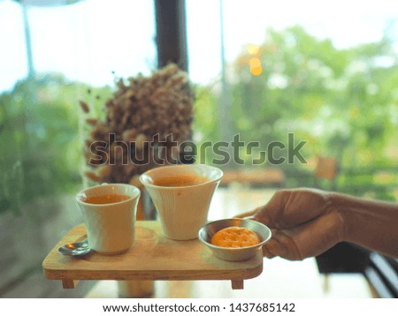 Coffee cup in coffee shop on table whit blur background , vintage style effect picture