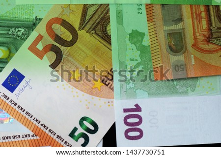 One Hundred and Fifty euro banknotes green color toned close up