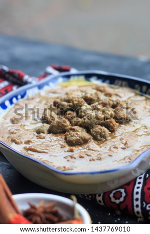 Stock photo of traditional Ramadan Dish,  boiled, cracked, or coarsely-ground wheat, mixed with meat called Hareesa