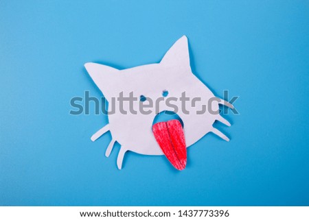 cartoon image of cat with red tongue