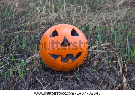 Jack lantern for Halloween of a basketball on scorched earth