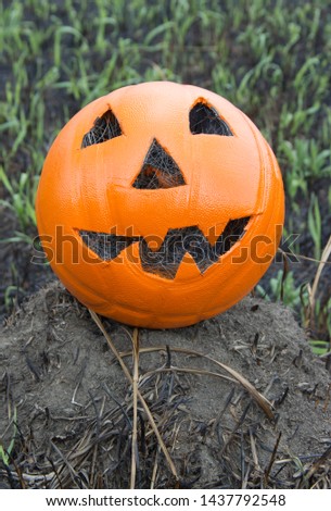 Jack lantern for Halloween of a basketball on scorched earth